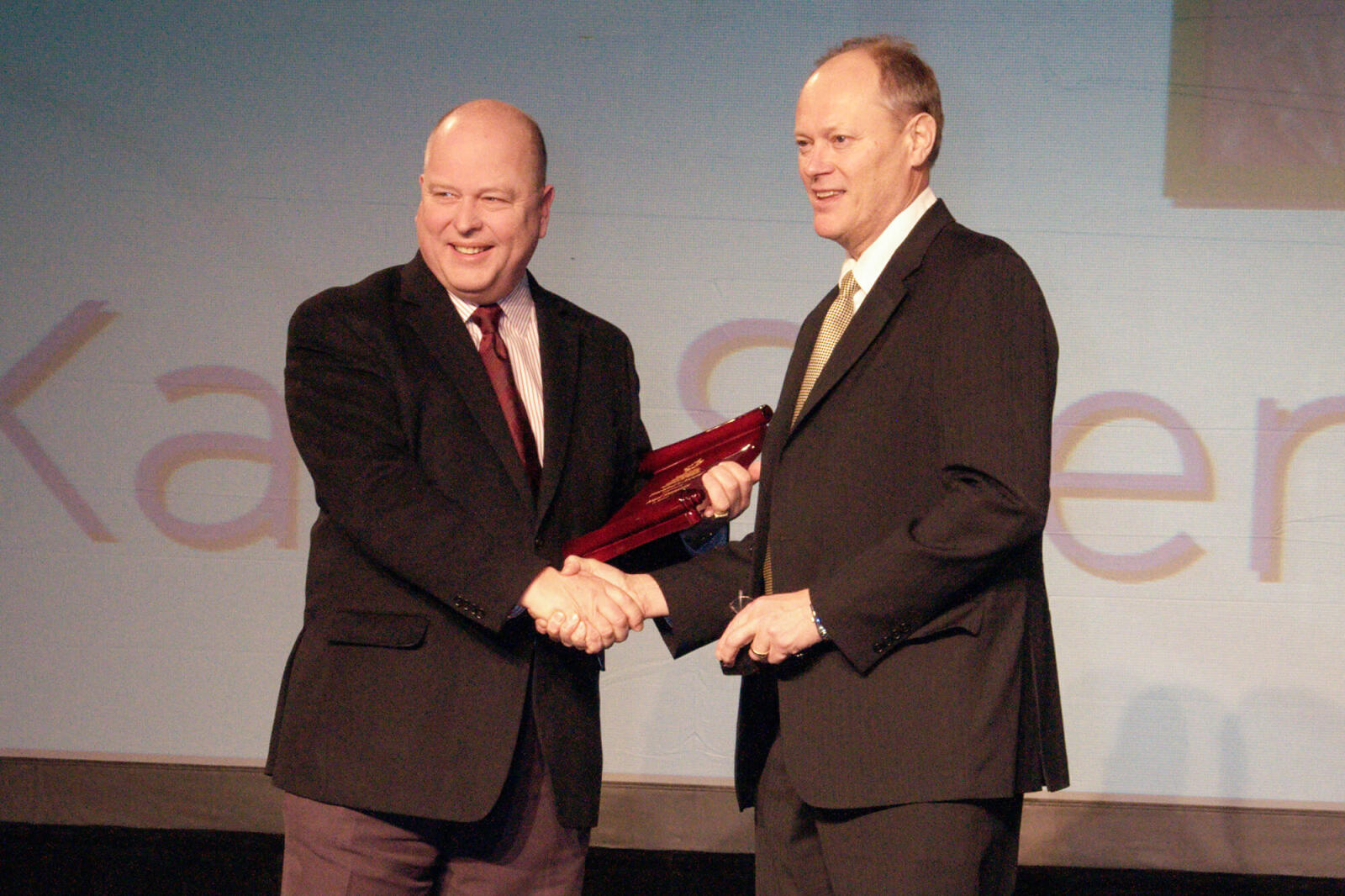 two men shaking hands